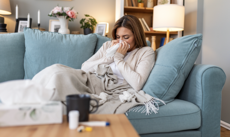 Patient sick on the couch with norovirus over the holiday season